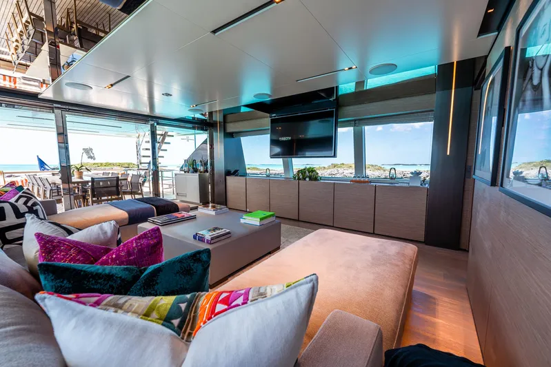Fifi Yacht Photos Pics Luxurious interior of 2018 Custom Line Navetta 33 yacht with vibrant cushions and ocean view.