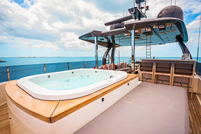 Fifi Yacht Photos Pics Luxurious 2018 Custom Line Navetta 33 yacht deck with jacuzzi and ocean view.