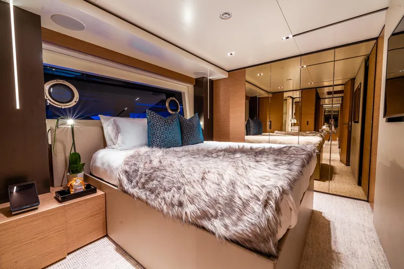 Fifi Yacht Photos Pics Luxurious bedroom interior on 2018 Custom Line Navetta 33 yacht, featuring elegant decor and plush bedding.
