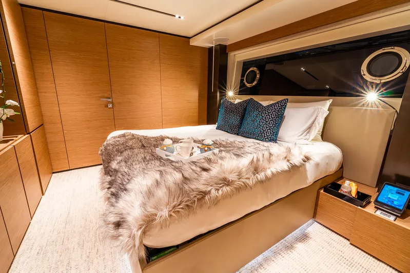 Fifi Yacht Photos Pics Luxurious bedroom interior on 2018 Custom Line Navetta 33 yacht, featuring elegant decor and cozy bedding.