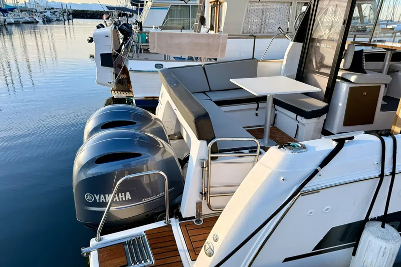  Yacht Photos Pics 2022 Jeanneau NC Weekender 895 with Yamaha engines docked at marina.