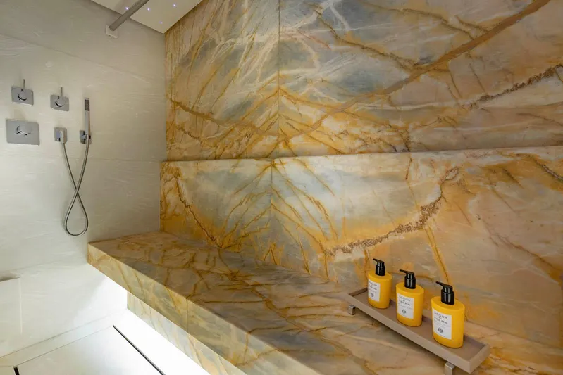 Moonstone Yacht Photos Pics Luxurious marble shower in 2021 Amels 200 yacht with elegant fixtures and toiletries.