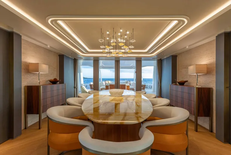 Moonstone Yacht Photos Pics Luxurious dining area on the 2021 Amels 200 yacht, featuring elegant decor and ocean views.