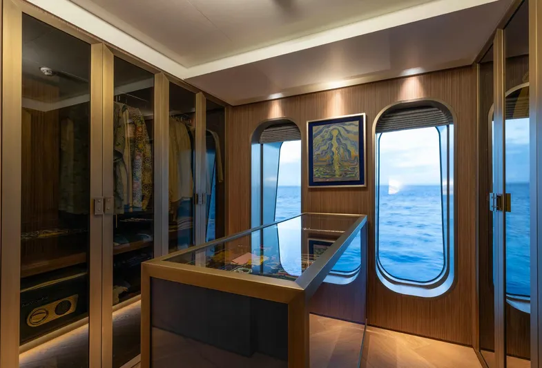 Moonstone Yacht Photos Pics Luxurious interior of 2021 Amels 200 yacht with ocean view and elegant wood finishes.