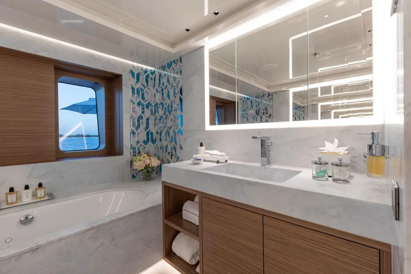 Moonstone Yacht Photos Pics Luxurious bathroom in 2021 Amels 200 yacht with modern design and ocean view.