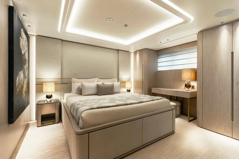 Moonstone Yacht Photos Pics Luxurious bedroom interior on Amels 200 yacht, 2021 model, featuring modern design and ambient lighting.