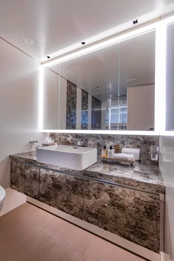 Moonstone Yacht Photos Pics Luxurious bathroom on Amels 200 yacht, featuring modern sink and illuminated mirror, 2021 model.