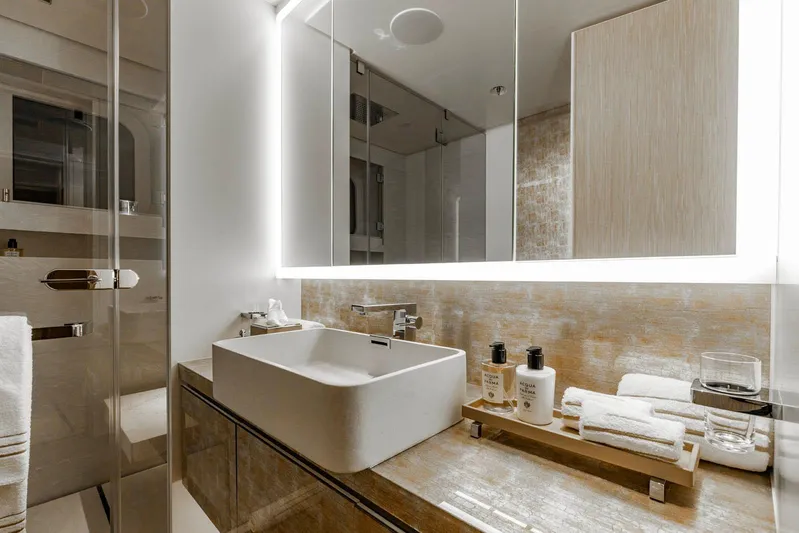 Moonstone Yacht Photos Pics Luxurious bathroom in 2021 Amels 200 yacht with modern sink and elegant toiletries.