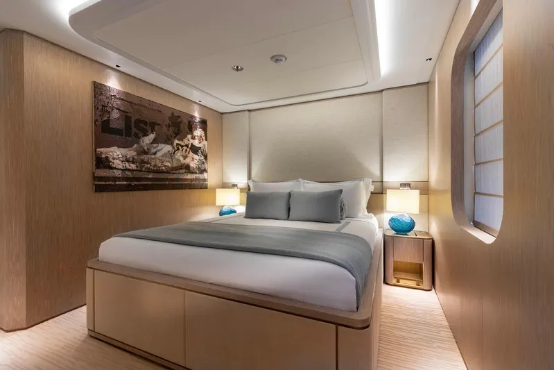 Moonstone Yacht Photos Pics Luxurious bedroom interior on 2021 Amels 200 yacht, featuring modern design and elegant decor.