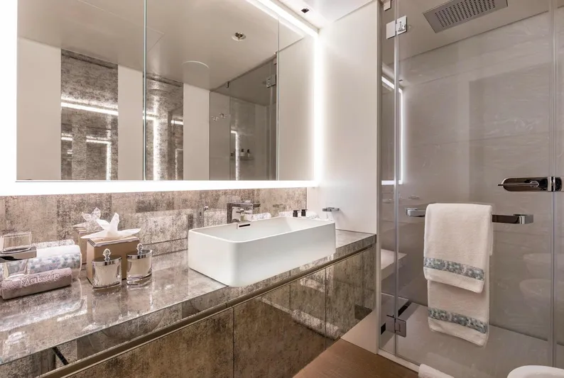 Moonstone Yacht Photos Pics Luxurious bathroom in 2021 Amels 200 yacht with modern fixtures and elegant design.