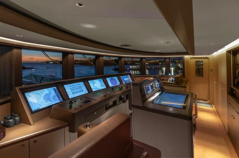 Moonstone Yacht Photos Pics Bridge of 2021 Amels 200 yacht with advanced navigation systems at sunset.