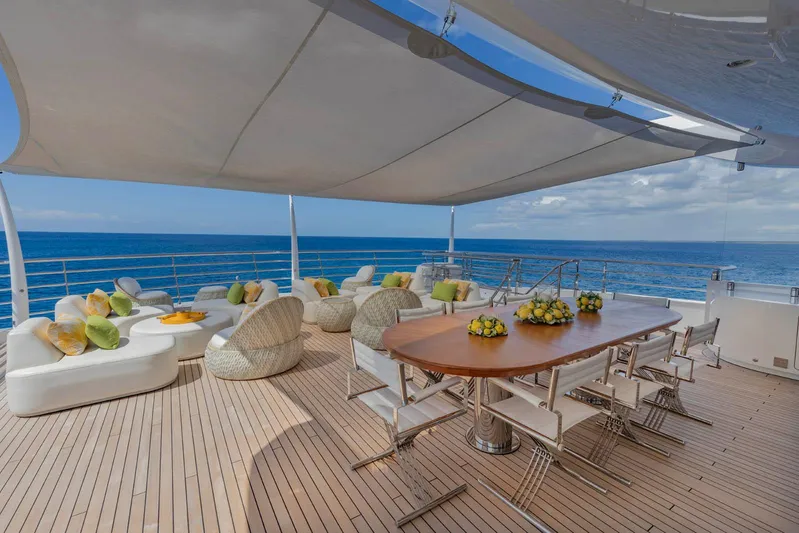 Moonstone Yacht Photos Pics Luxurious deck of 2021 Amels 200 yacht with ocean view and elegant seating.