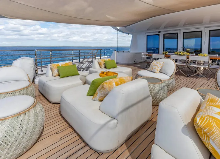 Moonstone Yacht Photos Pics Luxurious deck of 2021 Amels 200 yacht with plush seating and ocean view.