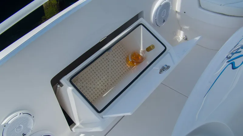 R&r Yacht Photos Pics Intrepid 400 Cuddy 2017 with open storage compartment and bottle.