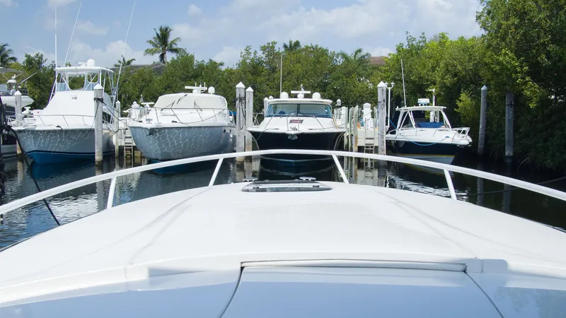 R&r Yacht Photos Pics Intrepid 400 Cuddy 2017 in a marina with other boats.