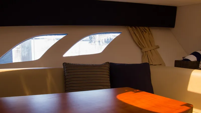 R&r Yacht Photos Pics Interior of 2017 Intrepid 400 Cuddy with windows and cushions.