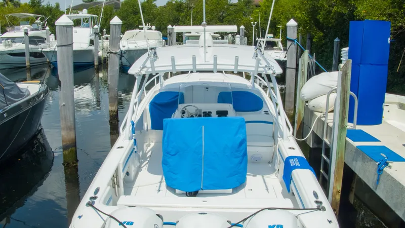 R&r Yacht Photos Pics 2017 Intrepid 400 Cuddy docked, featuring blue covers.