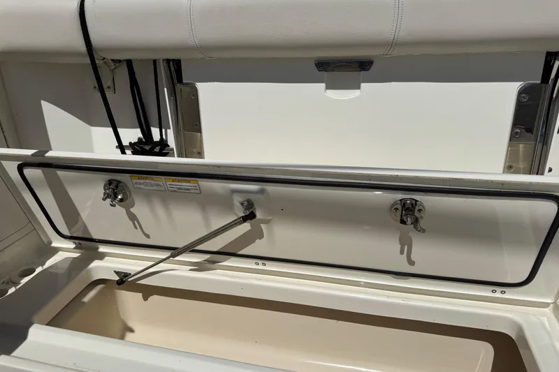  Yacht Photos Pics Open storage compartment on a 2018 Boston Whaler 285 Conquest boat.