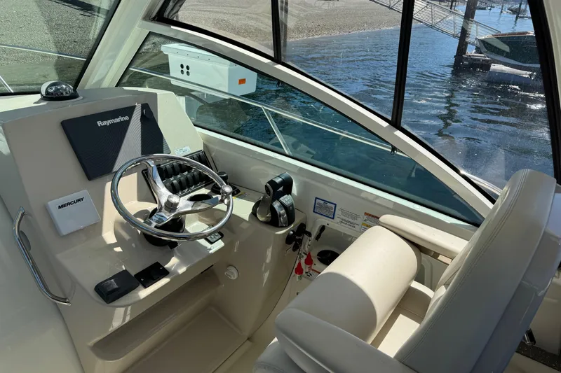  Yacht Photos Pics 2018 Boston Whaler 285 Conquest helm with Raymarine navigation and Mercury controls.