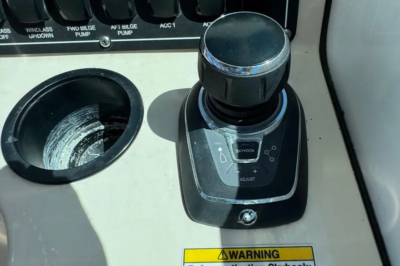  Yacht Photos Pics Control panel of a 2018 Boston Whaler 285 Conquest boat with joystick and switches.