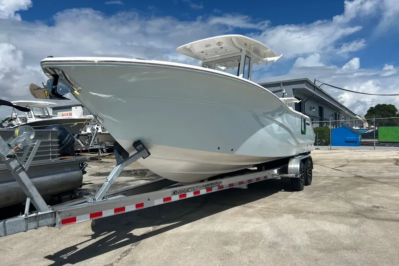  Yacht Photos Pics 2026 Sea Fox 268 Commander boat on trailer, parked outdoors under a blue sky.