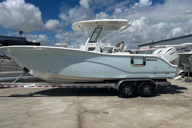  Yacht Photos Pics 2026 Sea Fox 268 Commander boat on trailer under cloudy sky.
