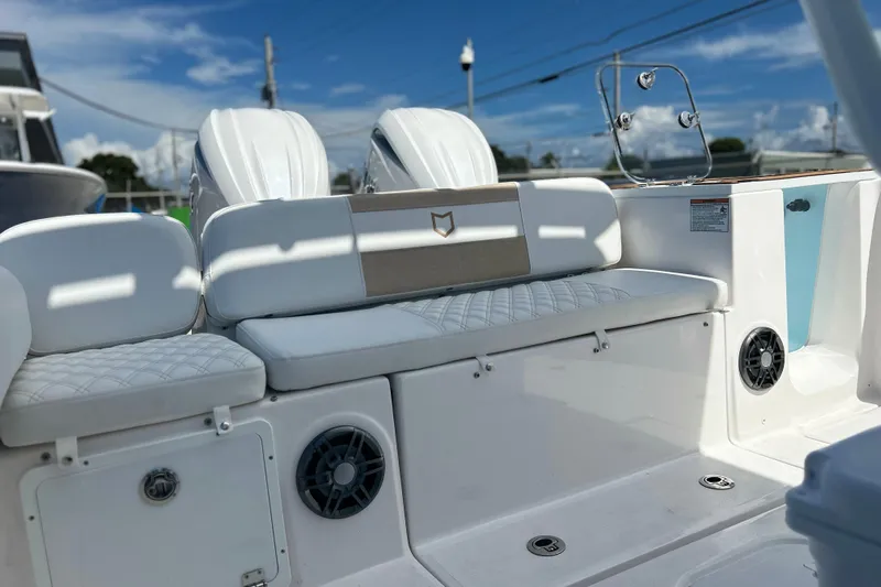  Yacht Photos Pics 2026 Sea Fox 268 Commander boat interior with white seating and speakers.