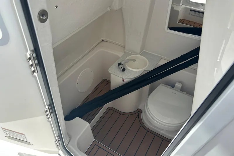 Yacht Photos Pics 2026 Sea Fox 268 Commander boat interior with compact bathroom and toilet.