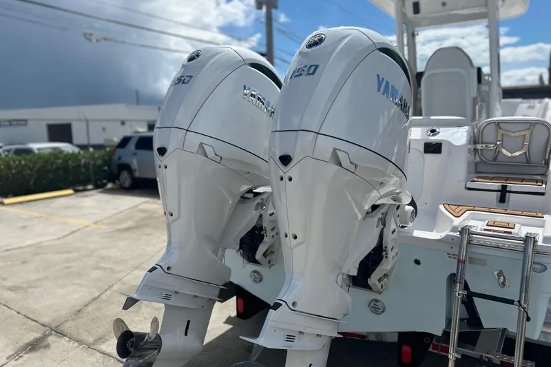  Yacht Photos Pics 2026 Sea Fox 268 Commander with twin Yamaha 150 outboard engines in a parking lot.