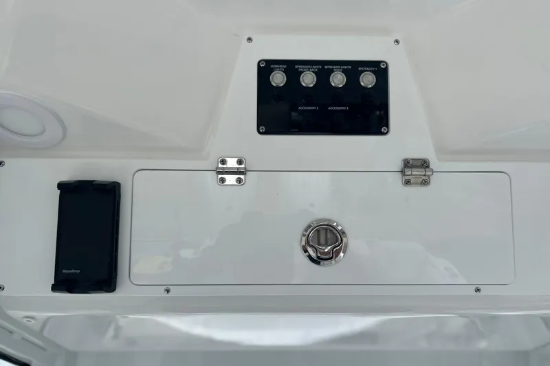  Yacht Photos Pics Control panel of 2026 Sea Fox 268 Commander boat with switches and storage compartment.