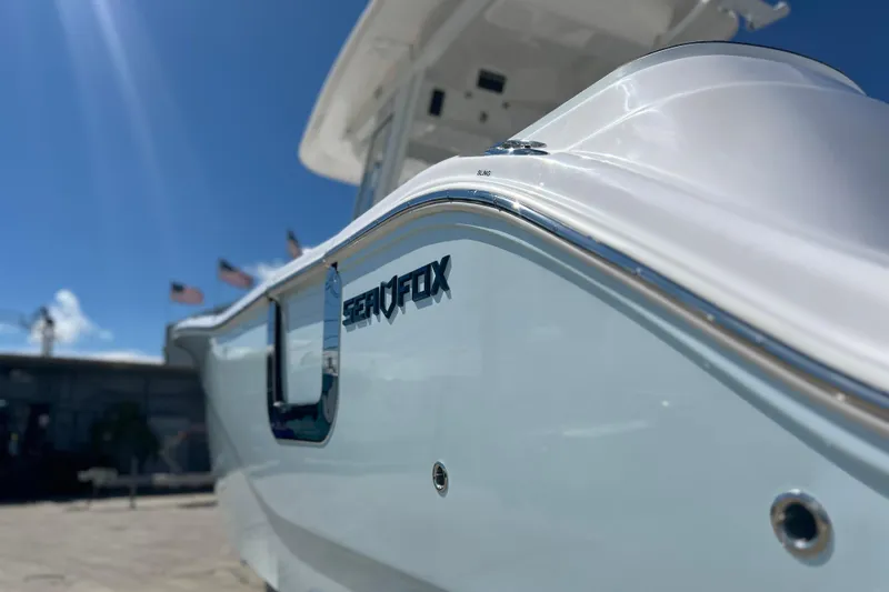  Yacht Photos Pics 2026 Sea Fox 268 Commander boat, sleek design under clear blue sky.