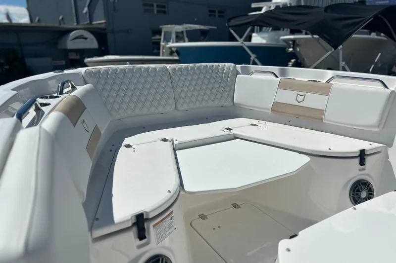  Yacht Photos Pics 2026 Sea Fox 268 Commander boat interior with cushioned seating and modern design.