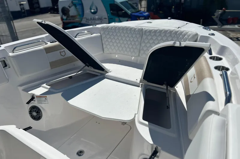  Yacht Photos Pics 2026 Sea Fox 268 Commander boat interior with open storage compartments and cushioned seating.