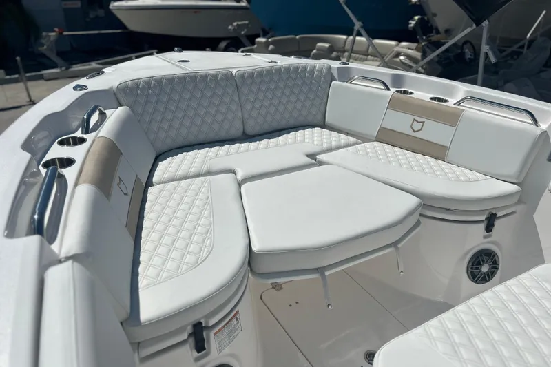  Yacht Photos Pics Luxurious seating on 2026 Sea Fox 268 Commander boat, featuring diamond-stitched upholstery and cup holders.