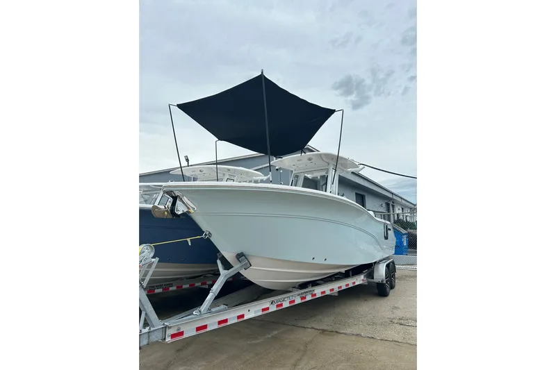 Yacht Photos Pics 2026 Sea Fox 268 Commander boat on trailer with canopy, ready for adventure.