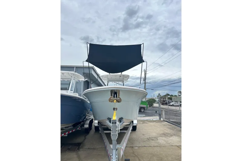  Yacht Photos Pics 2026 Sea Fox 268 Commander boat on trailer, under cloudy sky.