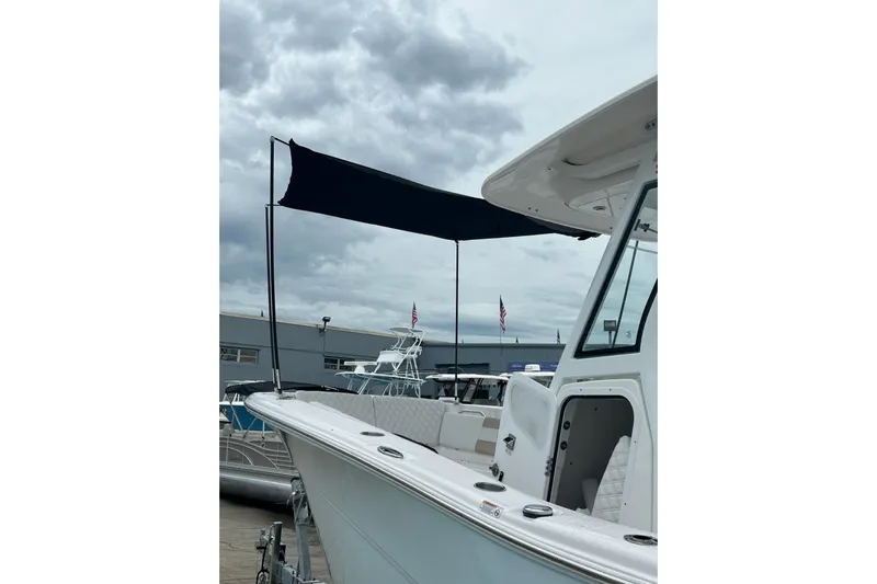  Yacht Photos Pics 2026 Sea Fox 268 Commander boat with canopy under cloudy sky.