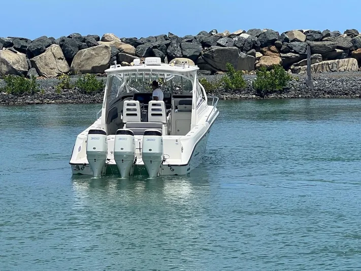  Yacht Photos Pics 2008 Hydra-Sports 3500VX boat with triple outboard engines on calm water.