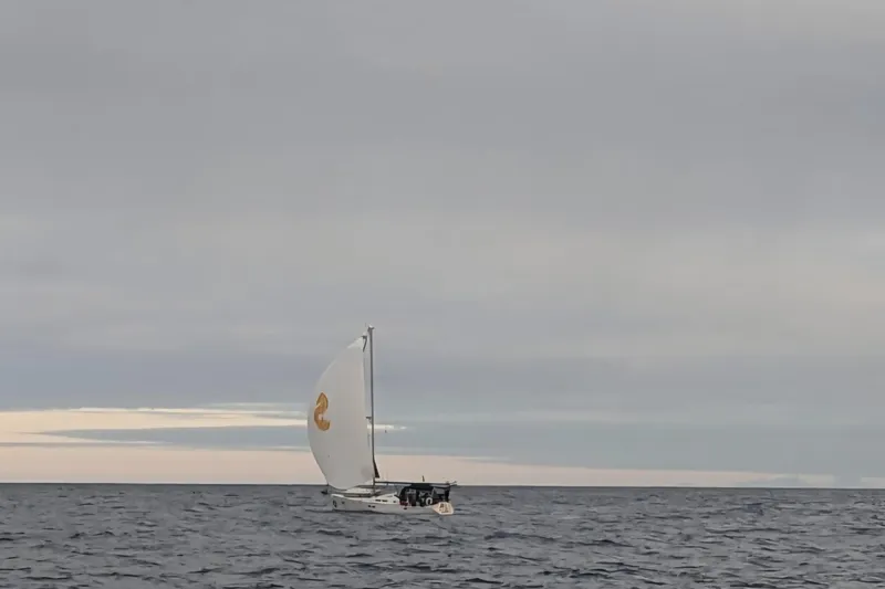 Anyroad Yacht Photos Pics Sailboat Beneteau 423 (2006) cruising on open sea under cloudy sky.