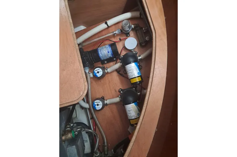 Anyroad Yacht Photos Pics Interior view of 2006 Beneteau 423 yacht showing plumbing and pump system.