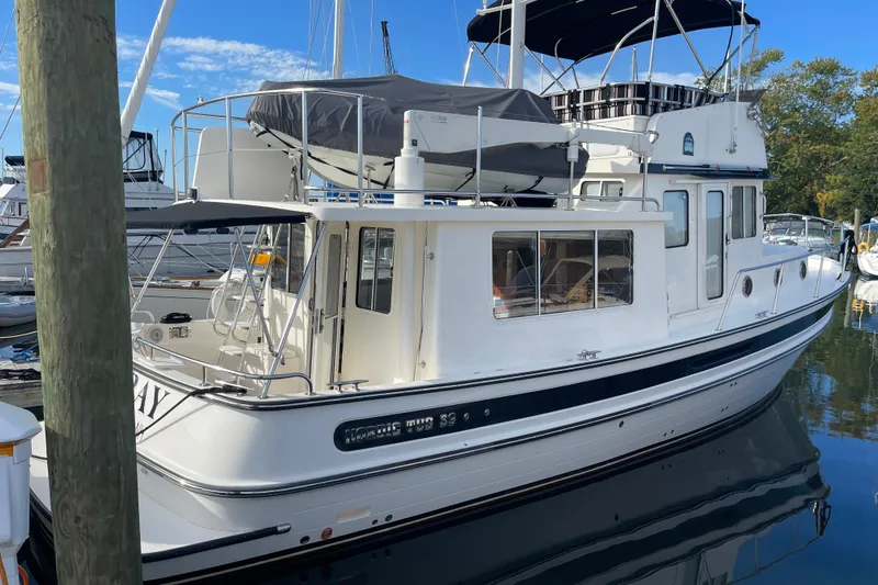 Spray Yacht Photos Pics 2015 Nordic Tug 39 Flybridge docked at marina, featuring sleek design and spacious deck.