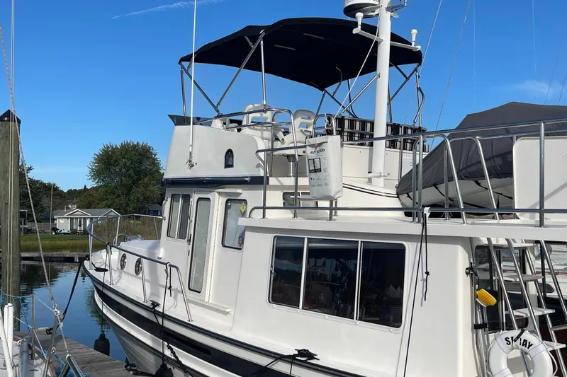 Spray Yacht Photos Pics 2015 Nordic Tug 39 Flybridge docked, featuring sleek design and spacious flybridge under clear blue sky.