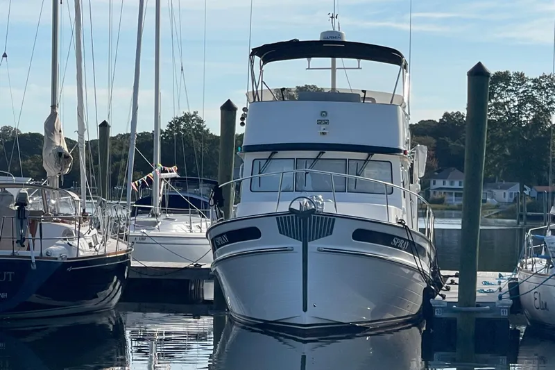 Spray Yacht Photos Pics 2015 Nordic Tug 39 Flybridge docked at marina, surrounded by sailboats.