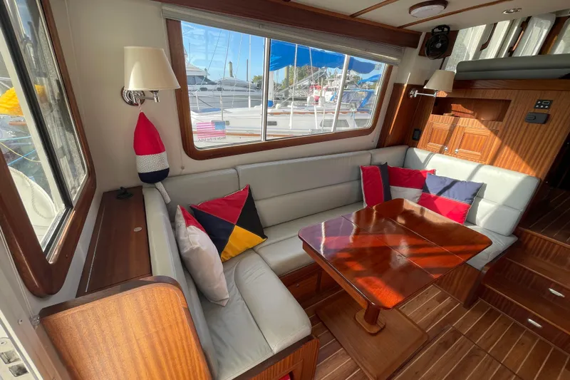 Spray Yacht Photos Pics Interior of 2015 Nordic Tug 39 with cozy seating and colorful cushions.