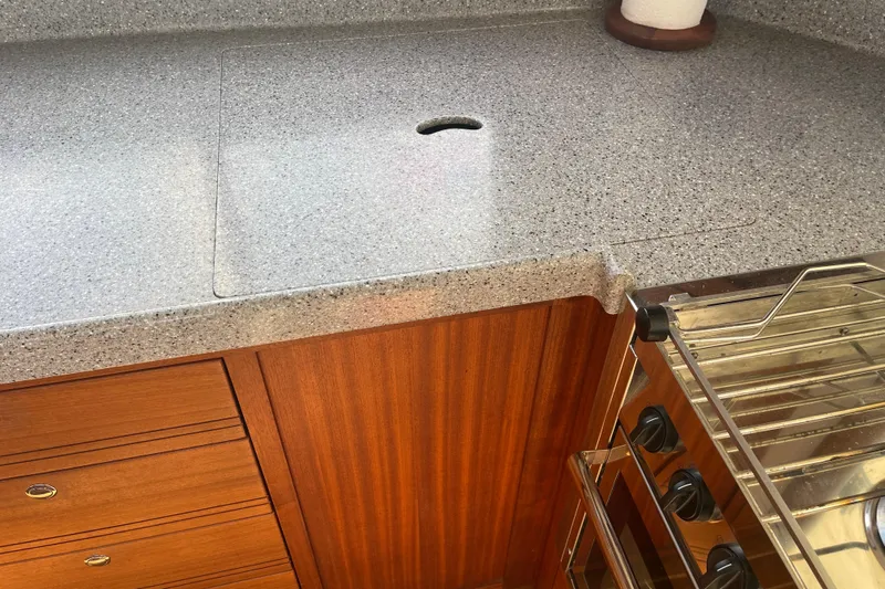 Spray Yacht Photos Pics 2015 Nordic Tug 39 kitchen with wooden cabinetry and granite countertop.