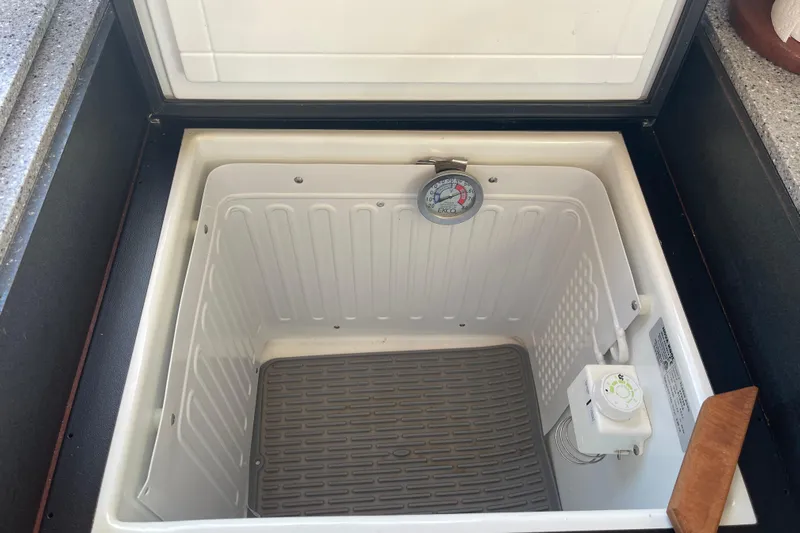 Spray Yacht Photos Pics Open storage compartment with thermometer in 2015 Nordic Tug 39 boat.