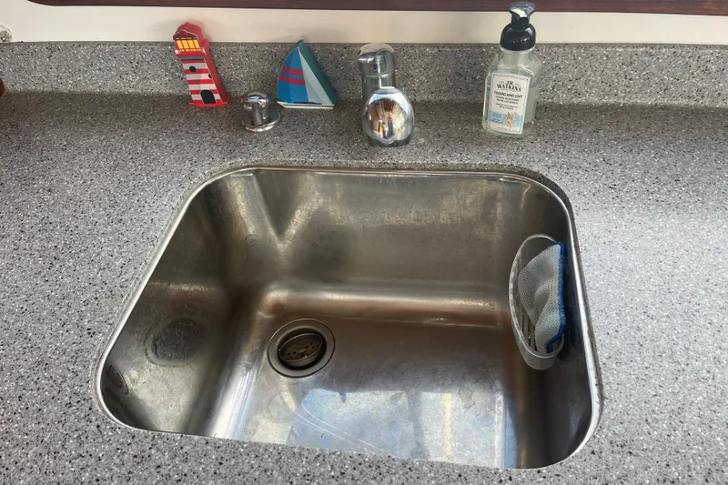 Spray Yacht Photos Pics Stainless steel sink on Nordic Tug 39, 2015 model, with soap dispenser and nautical decor.