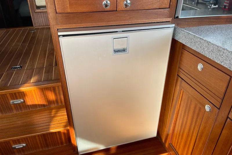Spray Yacht Photos Pics Compact fridge in 2015 Nordic Tug 39 boat kitchen with wooden cabinetry.