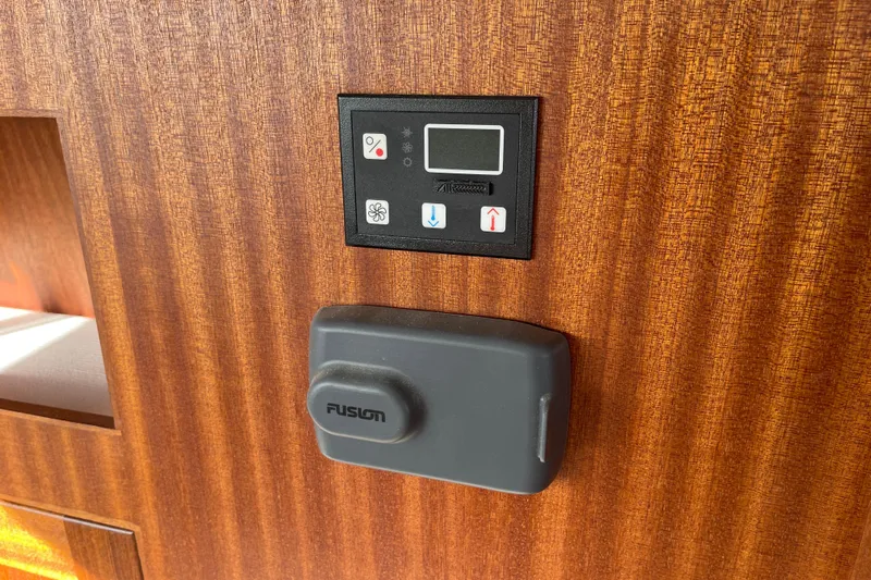 Spray Yacht Photos Pics Control panel and Fusion device on 2015 Nordic Tug 39 wooden interior.