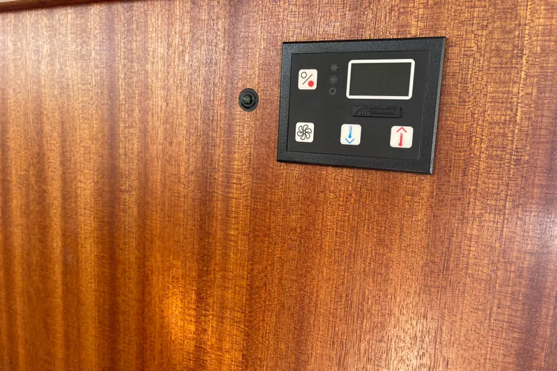 Spray Yacht Photos Pics Control panel on 2015 Nordic Tug 39 Flybridge, mounted on wooden surface.